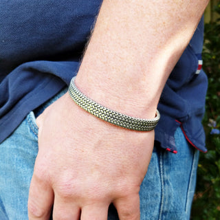 silver bangle on wrist