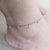 blue beaded anklet on ankle