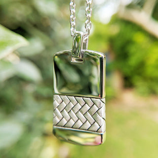 herringbone design on front of dog tag