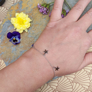 star charm bracelet on the wrist