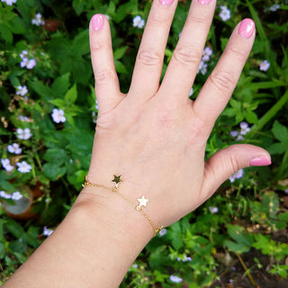 star charm bracelet on wrist