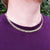 gold curb chain on man's neck