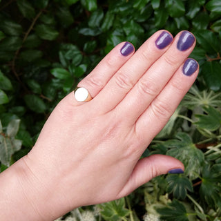 signet on woman's hand for scale