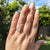 opal and diamond ring on hand
