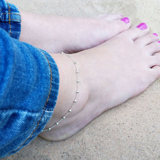 sterling silver anklet on woman's ankle