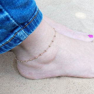 rose gold beaded anklet on ankle