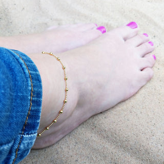 gold plated anklet being worn