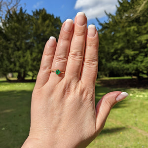 emerald diamond trilogy ring on hand
