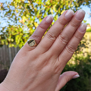 women's signet ring on hand