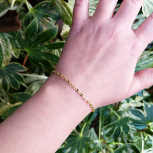 gold bracelet on ladies wrist