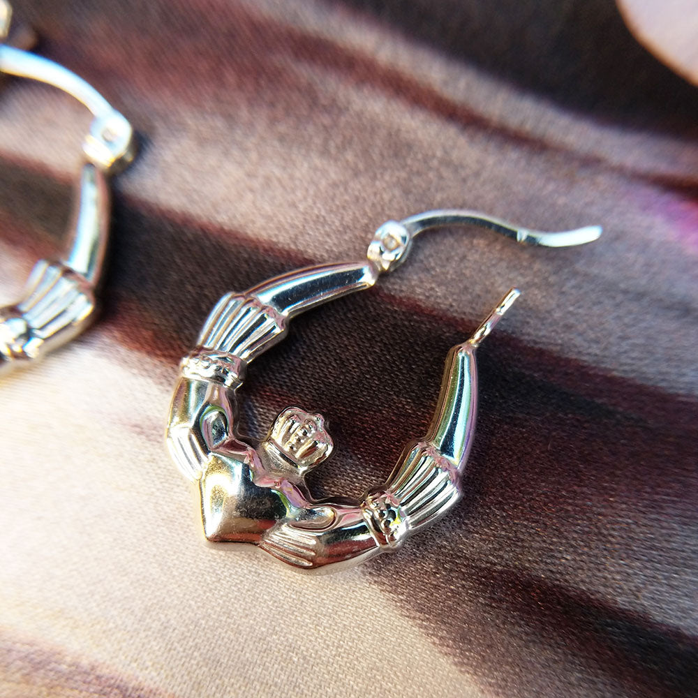 ladies claddagh earrings in silver