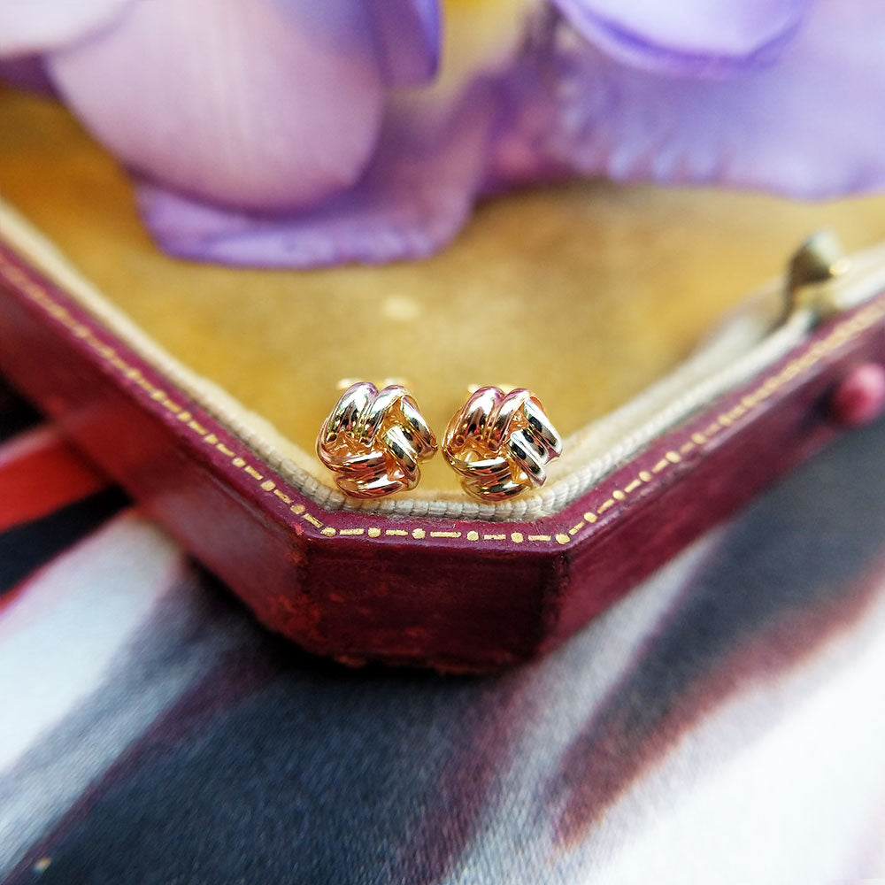 three gold knot stud earrings