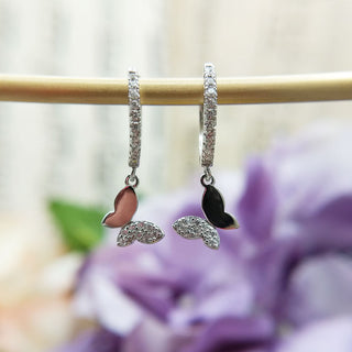 silver huggies with butterfly charms