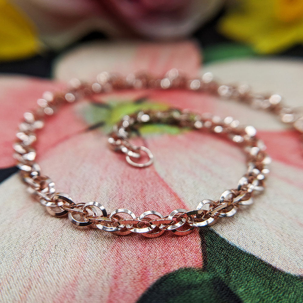 close up of rose gold prince of wales links