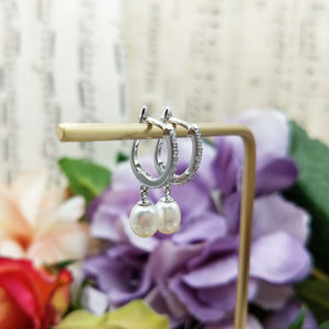 beautiful pearl huggie earrings in sterling silver