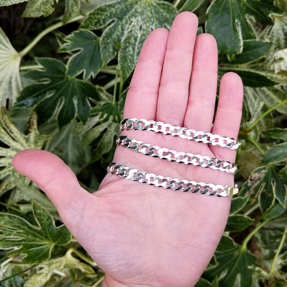 silver curb chain in hand
