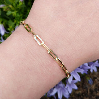 gold paper clip bracelet on wrist