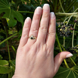 ladies gold claddagh ring on hand