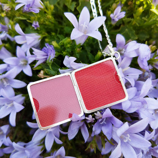 inside of silver locket with two spaces for photos