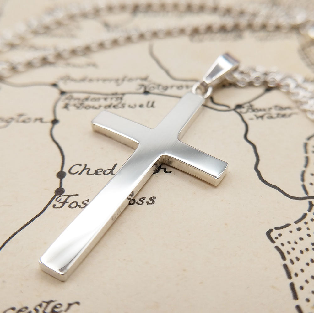close up of the silver cross pendant
