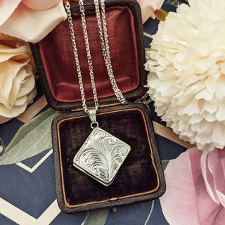 silver photo locket and chain