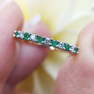 emerald and diamond half eternity ring