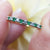 emerald and diamond half eternity ring