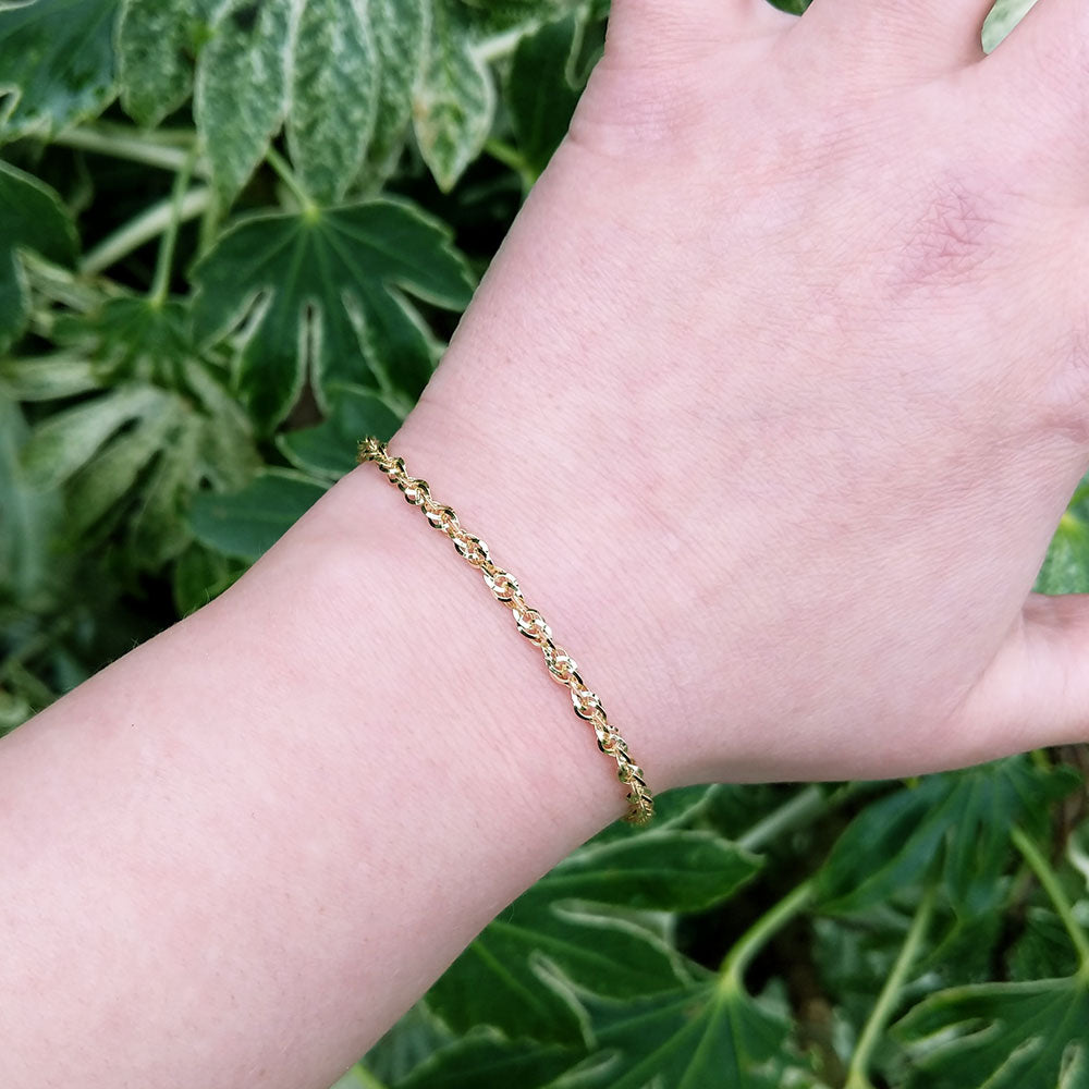 yellow gold bracelet on arm for scale
