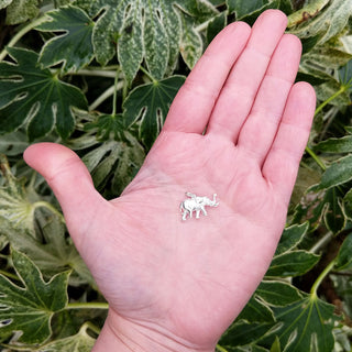 elephant charm in hand for scale