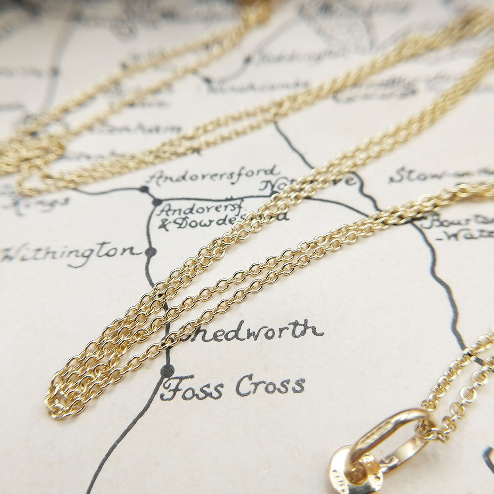 close up of solid gold trace chain