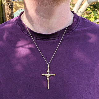 men's gold crucifix on neck