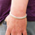 cuban curb bracelet on man's wrist