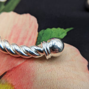 close up of silver celtic bangle for men