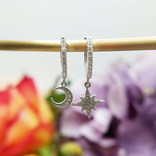 sterling silver charm huggie earrings with moon and star