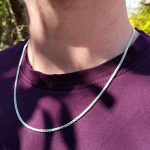 spiga chain on man's neck