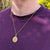 gold st christopher necklace on man's neck