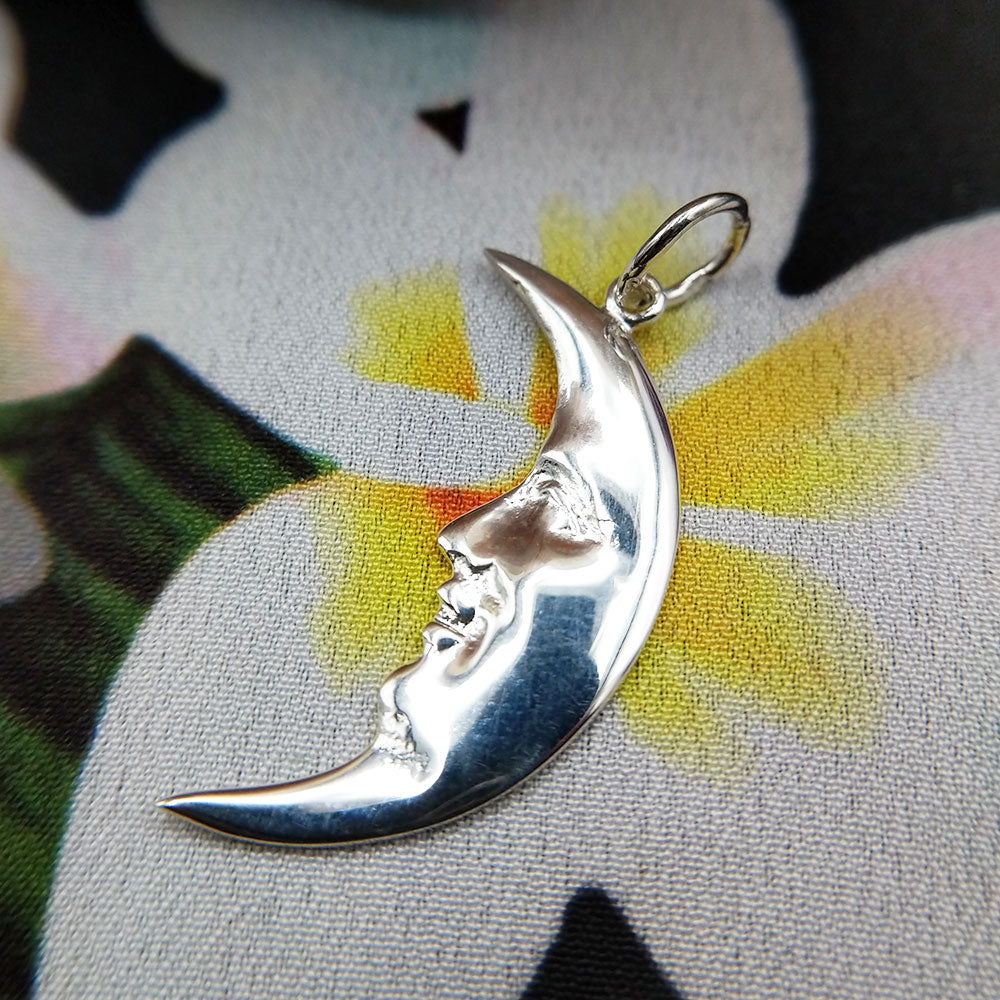 close up of moon face pendant