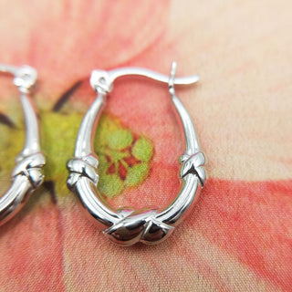 close up of knot design on creole earrings