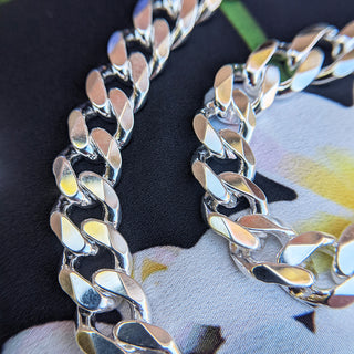 close up view of solid silver curb links