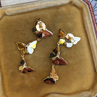 underside of gold butterfly drop earrings