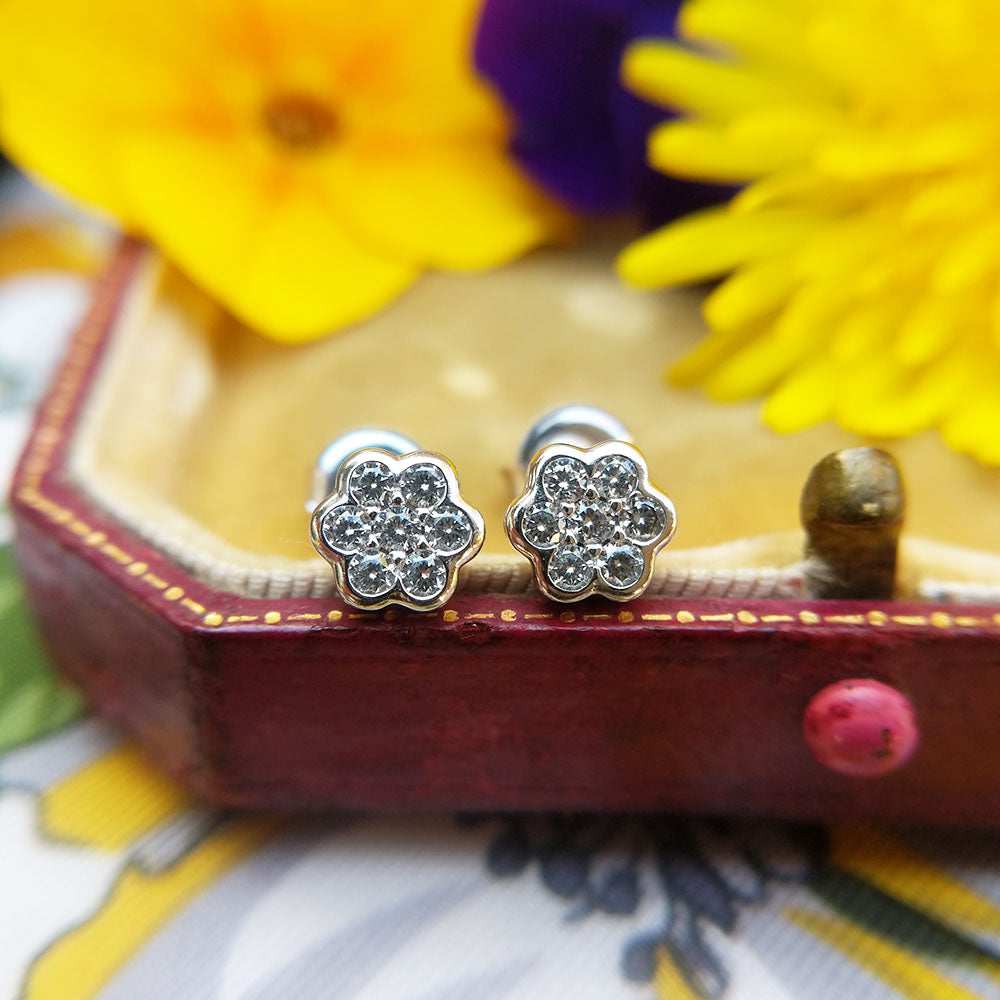 close up of our women's white gold flower stud earrings