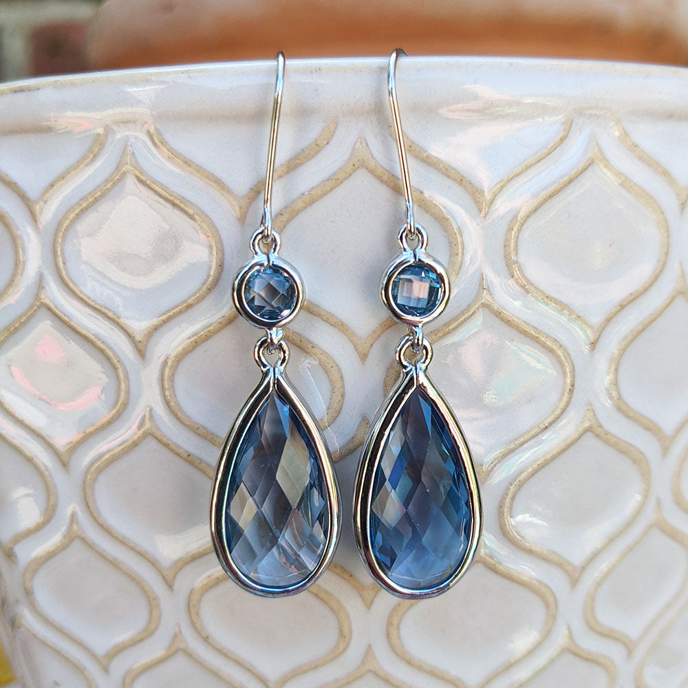 large silver teardrop earrings with blue cubic zirconia stones