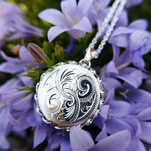 women's silver locket with hand engraved pattern