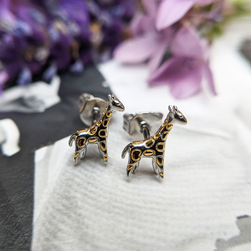 close up of giraffe earrings