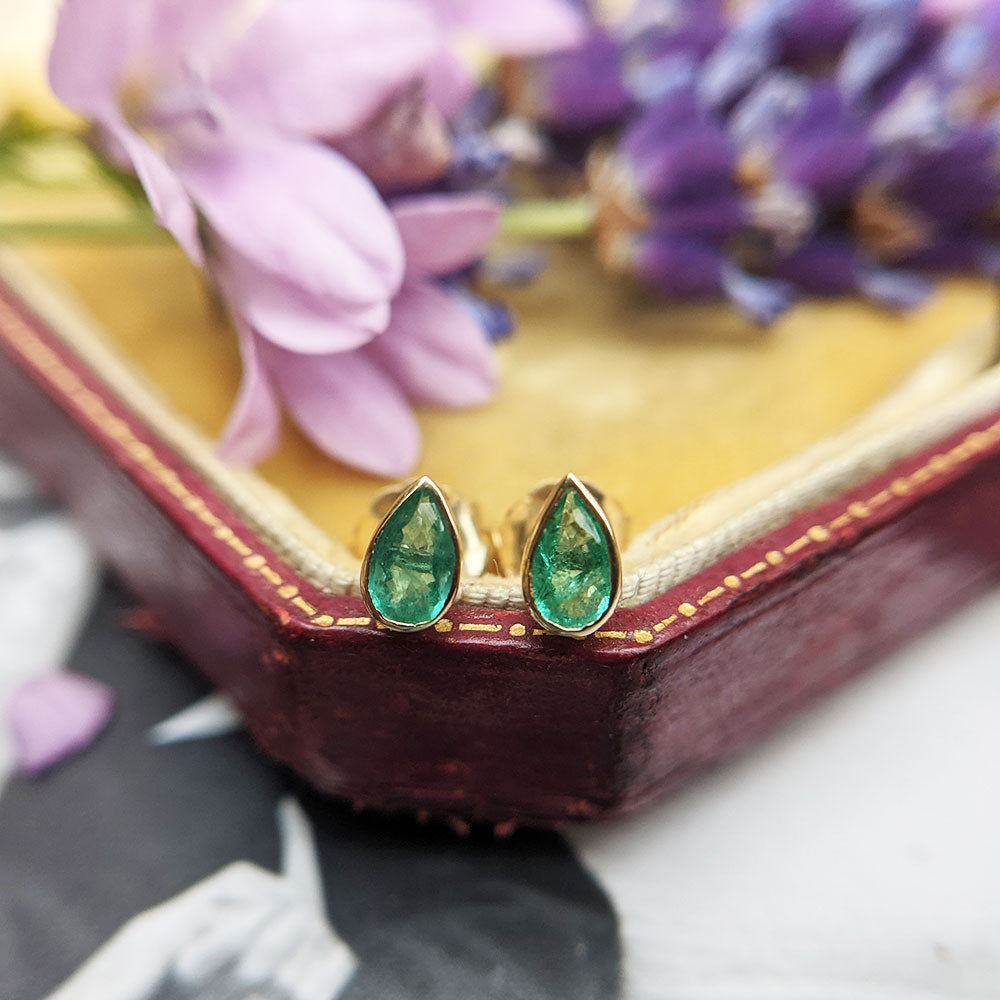 real emerald studs in gold