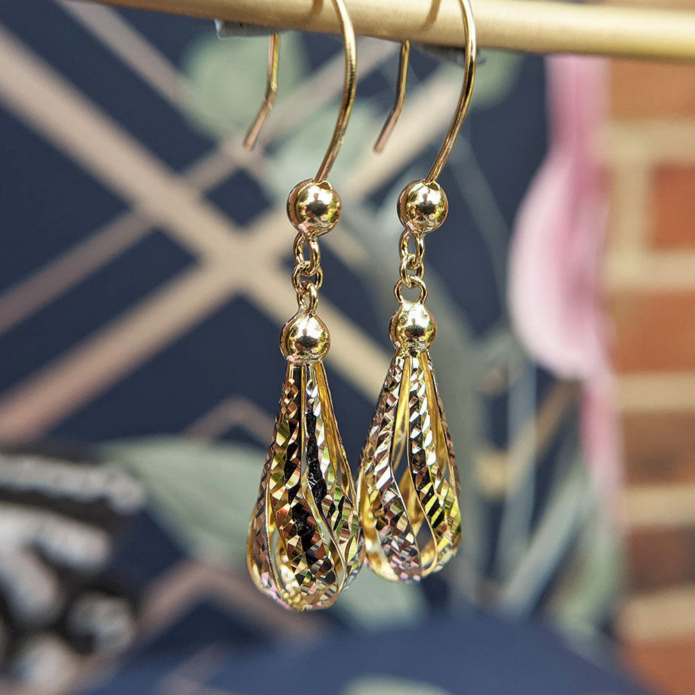 ladies drop earrings in white and yellow gold