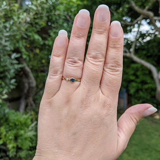 topaz and diamond gold ring on hand