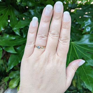 aquamarine and diamond ring on hand