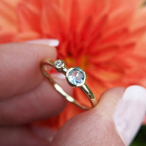 close up of aquamarine and diamond ring