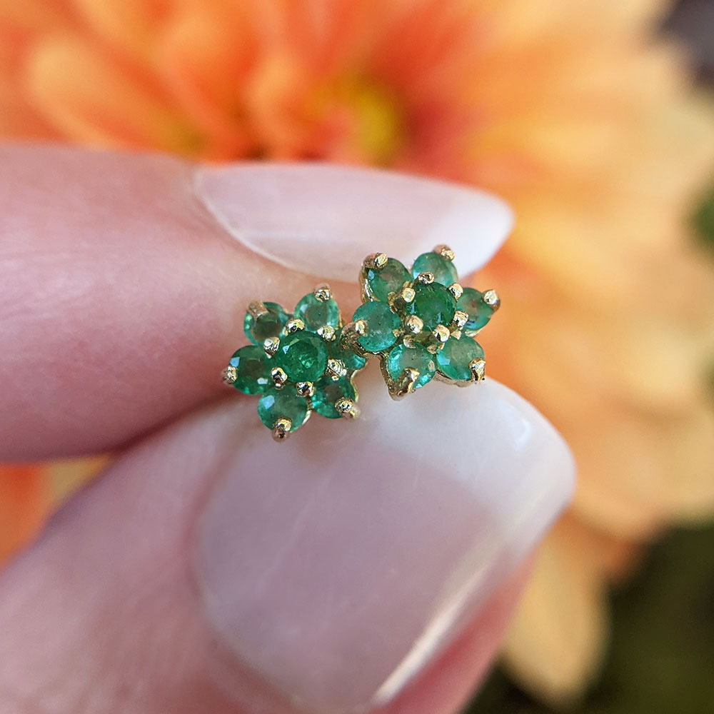 dainty emerald flower studs in 9ct gold